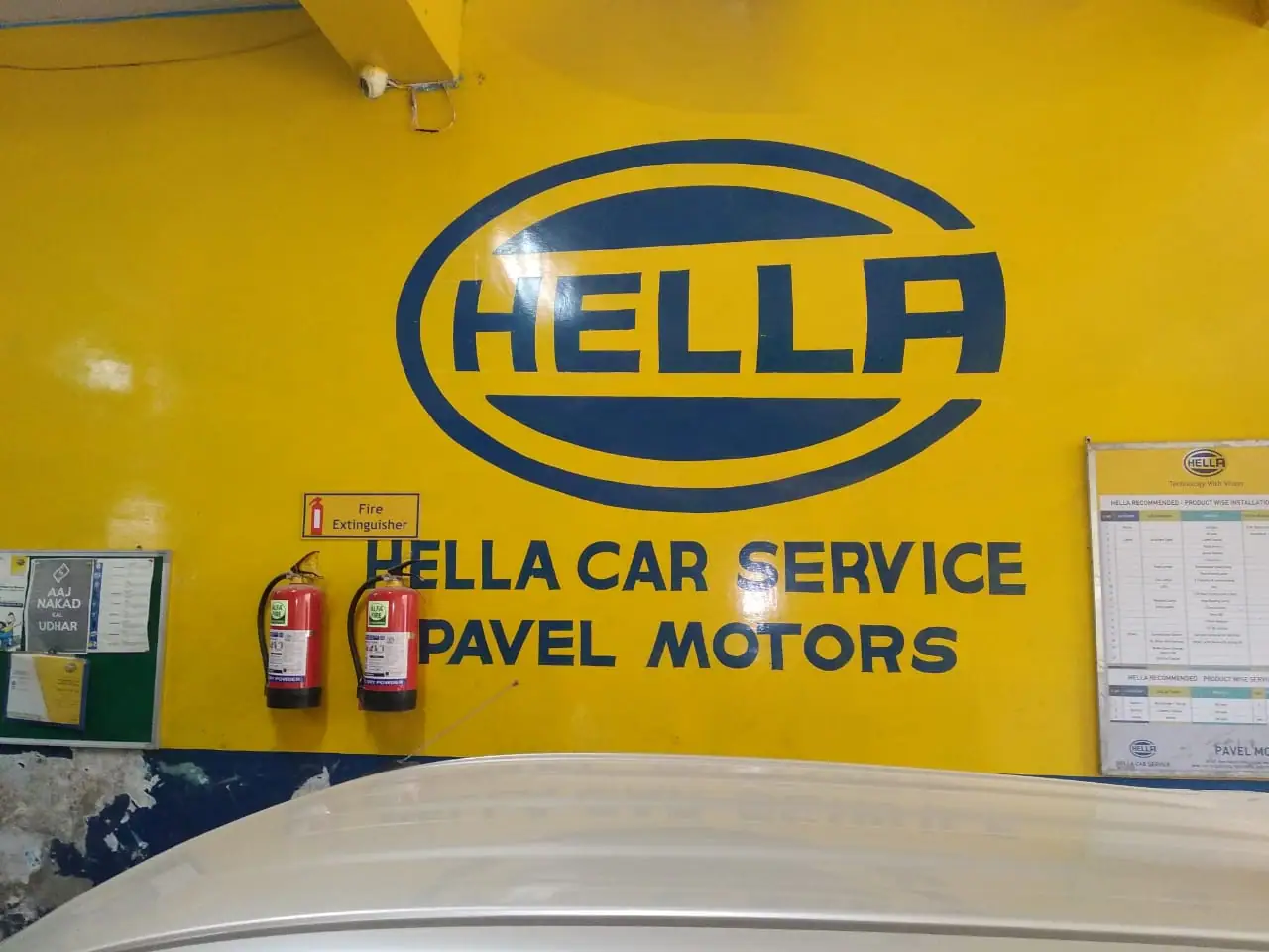 Hella Car Service signage at Pavel Motors